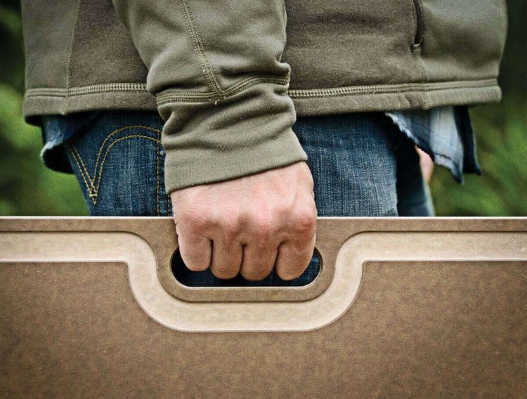 Big Game Cutting Board Nutmeg Being Held By Handle